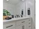 Modern bathroom with white cabinets, a white quartz countertop, matte black hardware and fixtures, and a large mirror at 206 Pine Meadow St, Hickory, NC 28601