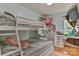 bedroom featuring a full sized bunkbed, desk and storage with views to outside at 206 Pine Meadow St, Hickory, NC 28601