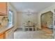 View of the eat-in kitchen dining area, leading into an adjacent living area at 206 Pine Meadow St, Hickory, NC 28601