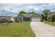 Inviting home with well-maintained lawn, mature trees, and a spacious driveway at 206 Pine Meadow St, Hickory, NC 28601