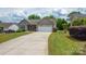 Beautiful home with manicured lawn, spacious driveway, and attached two-car garage at 206 Pine Meadow St, Hickory, NC 28601