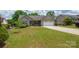 Charming single-story home with manicured lawn and attached two-car garage at 206 Pine Meadow St, Hickory, NC 28601