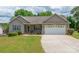Well-kept home featuring a manicured front yard and attached two-car garage at 206 Pine Meadow St, Hickory, NC 28601
