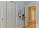 Hallway with a linen closet and access to an adjacent room with a neutral color scheme at 206 Pine Meadow St, Hickory, NC 28601