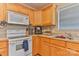 The kitchen features laminate countertops, white appliances, and ample wooden cabinetry at 206 Pine Meadow St, Hickory, NC 28601