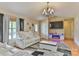 The living room features vaulted ceilings, hardwood floors, and a modern fireplace at 206 Pine Meadow St, Hickory, NC 28601