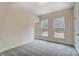 Clean bedroom with plush carpeting and two bright windows, a perfect relaxing space at 206 Streamwood Rd # 32, Troutman, NC 28166