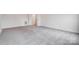 Neutral bedroom with carpeting, base trim, and a doorway leading to a walk-in closet for storage at 206 Streamwood Rd # 32, Troutman, NC 28166