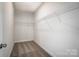 Walk-in closet space with carpeted floors and wire shelving for optimal storage solutions at 206 Streamwood Rd # 32, Troutman, NC 28166