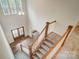 Elegant two-story foyer with hardwood floors, wooden and white stairway, and a grand entryway at 206 Streamwood Rd # 32, Troutman, NC 28166