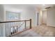 Upstairs hallway with carpet and a view of the foyer, offering a glimpse of the floor below at 206 Streamwood Rd # 32, Troutman, NC 28166