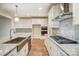 Modern kitchen features stainless steel appliances, white cabinetry, and granite countertops at 206 Streamwood Rd # 32, Troutman, NC 28166