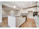 Spacious kitchen with granite countertops, a large island, and stainless steel appliances at 206 Streamwood Rd # 32, Troutman, NC 28166
