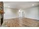 Expansive living room with a stone fireplace, hardwood floors, and ample space for entertaining at 206 Streamwood Rd # 32, Troutman, NC 28166