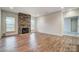 Spacious living room features a stone fireplace, hardwood floors, and recessed lighting at 206 Streamwood Rd # 32, Troutman, NC 28166