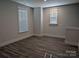 Spacious bedroom with wood flooring, neutral walls, and natural light from a window at 2068 Fordhill St, Rock Hill, SC 29732