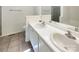 Bright bathroom featuring dual sinks with ample counter space, and tile flooring for easy maintenance at 211 Sherwood Cir, Rock Hill, SC 29730