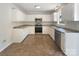 Functional kitchen featuring a stainless steel oven and microwave, white cabinets, and an undermounted sink at 211 Sherwood Cir, Rock Hill, SC 29730