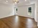 Large main bedroom featuring hardwood floors, recessed lighting, and large windows offering natural light at 211 Sherwood Cir, Rock Hill, SC 29730