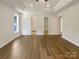 Spacious main bedroom with hardwood floors, recessed lighting, and tray ceiling, offering a luxurious feel at 211 Sherwood Cir, Rock Hill, SC 29730