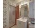 Practical bathroom featuring vintage floral wallpaper, a sink, and access to another room at 2213 Milton Rd, Charlotte, NC 28215
