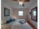 Relaxing bedroom featuring a bed with elegant decor and soft, natural lighting at 2213 Milton Rd, Charlotte, NC 28215