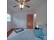 Bright bedroom with wood floors, ceiling fan, and a comfortable bed at 2213 Milton Rd, Charlotte, NC 28215