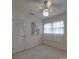 Bright bedroom featuring a ceiling fan, natural light, and a modern-style barn painting at 2213 Milton Rd, Charlotte, NC 28215