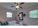 Cozy bedroom featuring a ceiling fan, natural light, and comfortable furnishings at 2213 Milton Rd, Charlotte, NC 28215