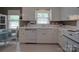 Functional kitchen with white appliances, ample counter space, and a window offering natural light and views at 2213 Milton Rd, Charlotte, NC 28215
