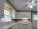Bright kitchen with white cabinets, a ceiling fan, and a window, providing a functional and inviting cooking space at 2213 Milton Rd, Charlotte, NC 28215