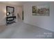 Inviting living room with a staircase, accent table, mirror, and a painting creating a warm and welcoming ambiance at 2213 Milton Rd, Charlotte, NC 28215
