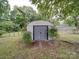Exterior view of backyard shed with secure doors and concrete foundation at 2213 Milton Rd, Charlotte, NC 28215