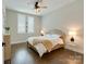 Cozy bedroom with wood floors, ceiling fan, and bright natural light at 2401 Euclid Ave # 207, Charlotte, NC 28203