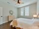 Cozy bedroom with wood floors, ceiling fan, and bright natural light at 2401 Euclid Ave # 207, Charlotte, NC 28203