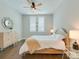 Cozy bedroom with wood floors, ceiling fan, and bright natural light at 2401 Euclid Ave # 207, Charlotte, NC 28203