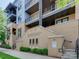 Stylish condo building with multi-story balconies, brick facade and well-maintained landscaping at 2401 Euclid Ave # 207, Charlotte, NC 28203