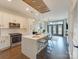Open kitchen concept with island seating, wood floors, and stainless steel appliances at 2401 Euclid Ave # 207, Charlotte, NC 28203