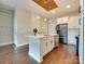 Stylish kitchen with island seating, modern appliances, and open floor plan at 2401 Euclid Ave # 207, Charlotte, NC 28203