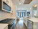 Modern open kitchen featuring stainless steel appliances and hardwood flooring at 2401 Euclid Ave # 207, Charlotte, NC 28203