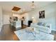 Open concept living room with modern lighting fixture and connection to the kitchen at 2401 Euclid Ave # 207, Charlotte, NC 28203
