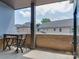 Outdoor patio with a table and chairs and view of other residential housing at 2401 Euclid Ave # 207, Charlotte, NC 28203