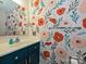 Bathroom featuring a vanity with floral wallpaper and a mirror at 2437 Woodleigh Dr, Gastonia, NC 28056