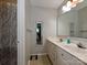 Simple bathroom features a double sink vanity and shower with curtain at 2437 Woodleigh Dr, Gastonia, NC 28056