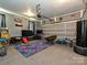 Finished garage features a variety of arcade games and entertainment for and adults at 2437 Woodleigh Dr, Gastonia, NC 28056