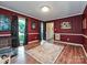 Bright living room featuring hardwood floors, high wainscotting, and modern lighting at 2437 Woodleigh Dr, Gastonia, NC 28056
