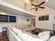 Bright living room features a large comfortable sectional, ceiling fan, and white shiplap walls at 2437 Woodleigh Dr, Gastonia, NC 28056