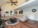 Charming living room with a large sectional, hardwood floors, and second story loft at 2437 Woodleigh Dr, Gastonia, NC 28056