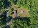 A home with a lush, green yard, outbuilding, and mature trees from an aerial perspective at 2871 Loviee Rd, Lincolnton, NC 28092