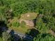 Aerial view of a home surrounded by trees and lush greenery with a long driveway at 2871 Loviee Rd, Lincolnton, NC 28092